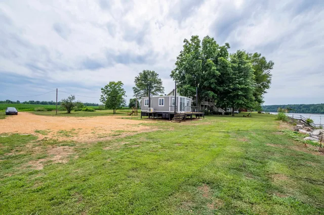 an aerial view of a residential houses with outdoor space