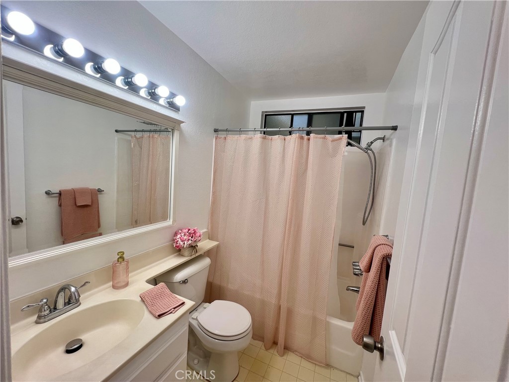 3516 East Ransom Street, Unit 204 Long Beach, CA 90804 - Photo 22 of 38 a bathroom with a sink toilet and shower