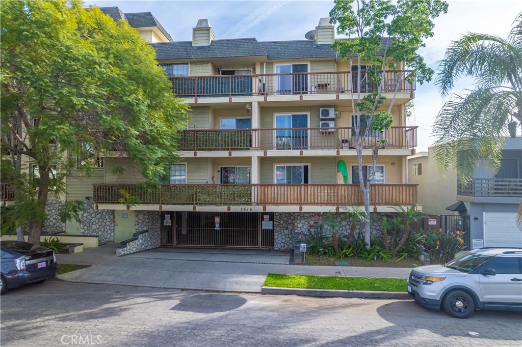 3516 East Ransom Street, Unit 204 Long Beach, CA 90804 - Photo 24 of 38 a view of a car park in front of house