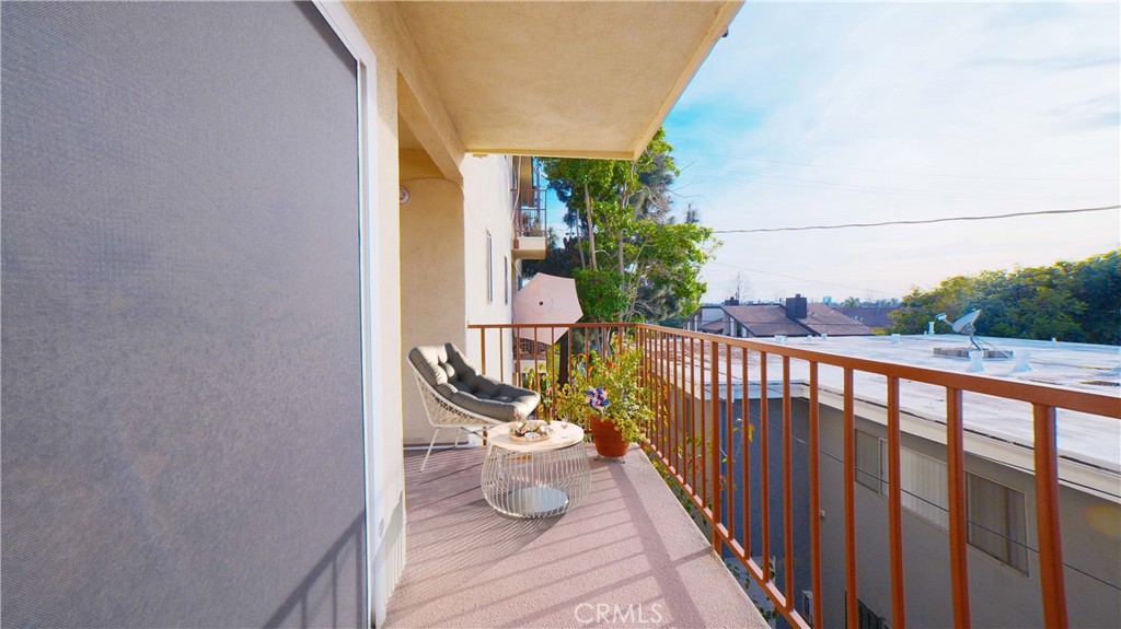 3516 East Ransom Street, Unit 204 Long Beach, CA 90804 - Photo 35 of 38 a balcony with wooden floor