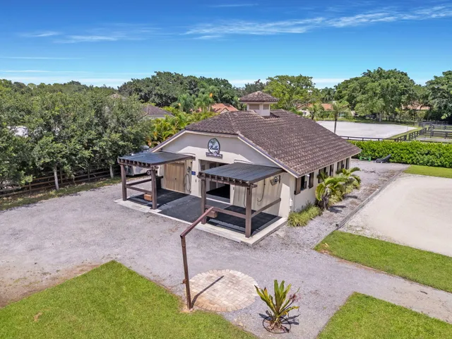 a kitchen with stainless steel appliances granite countertop a refrigerator and cabinets