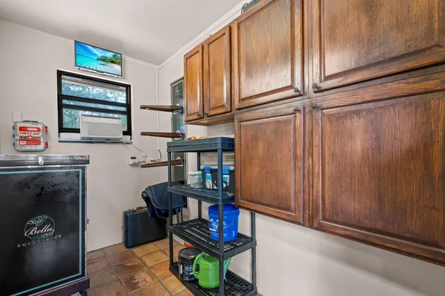 a kitchen with stainless steel appliances granite countertop a sink and cabinets