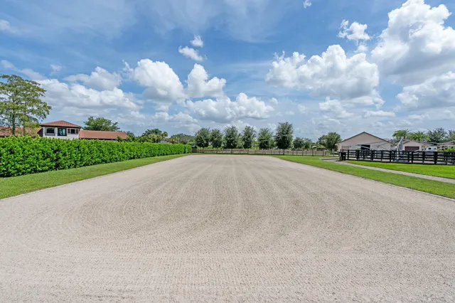 a kitchen with stainless steel appliances granite countertop a sink and a refrigerator