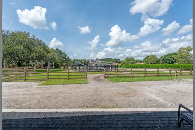 a view of kitchen with microwave and cabinets