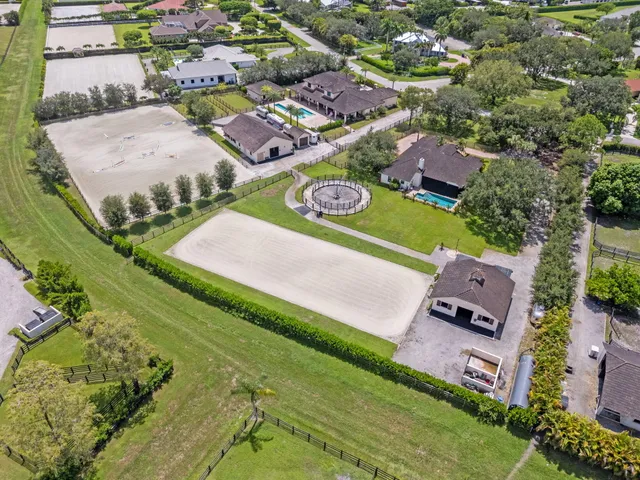 a bedroom with a bed ceiling fan and a window