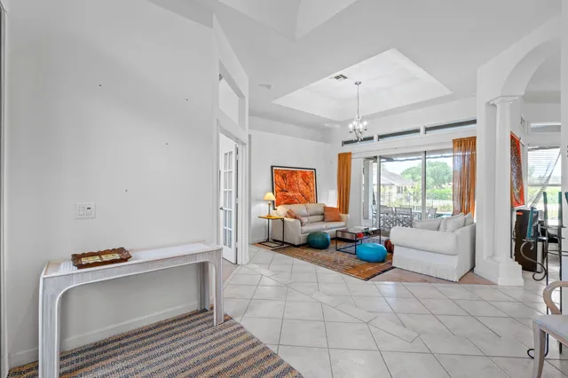 a spacious bathroom with a granite countertop sink mirror and bathtub