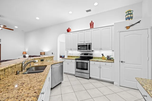 a bedroom with a bed and a lamp