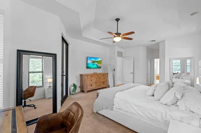 a view of a garden with a building in the background