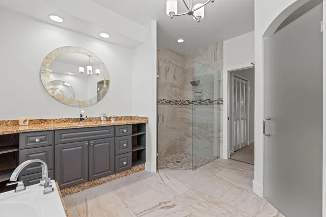 an aerial view of a swimming pool yard and mountain view in back