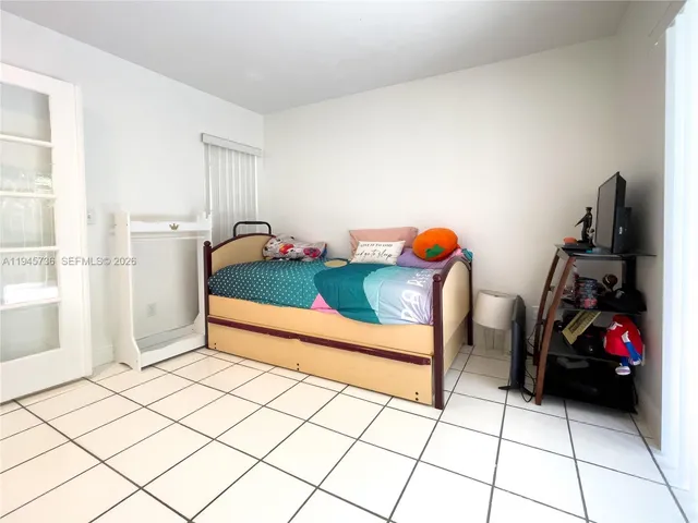 a bedroom with furniture and a bed