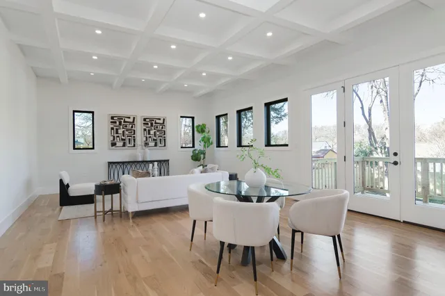 a dining room with furniture and wooden floor