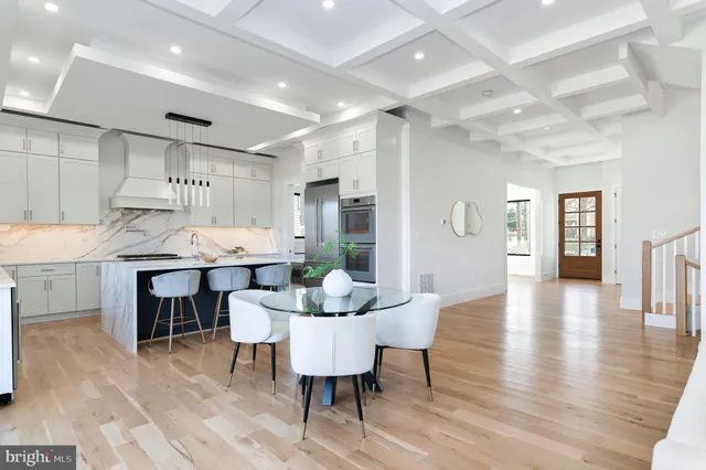 a dining room with furniture and wooden floor