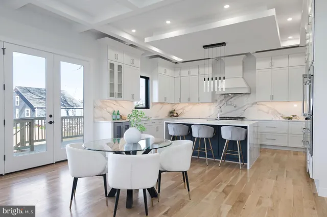 a bedroom with a bed and glass walk in closet