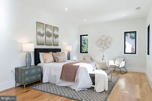 a bedroom with a bed and a couch