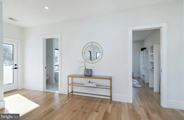 a bathroom with a sink vanity and a mirror