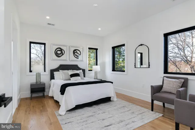 a view of a room with wooden floor and bathroom
