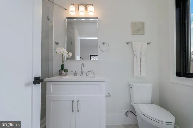 a bathroom with a shower and toilet