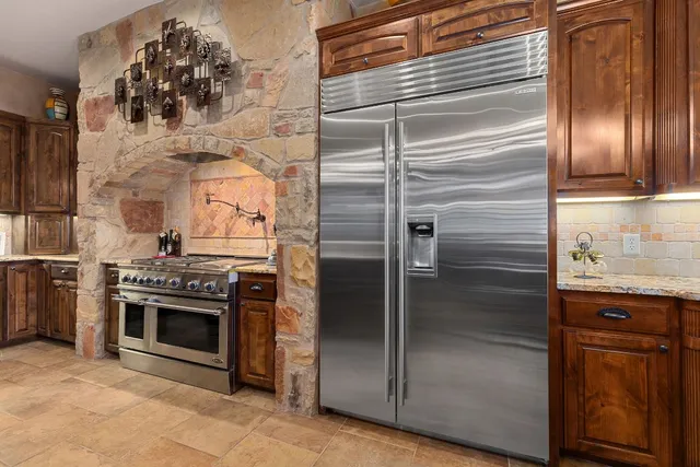 a open kitchen with a table and chairs in it