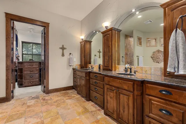 a bedroom with a bed couch and window