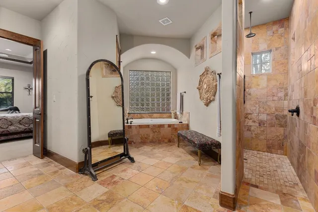 a bathroom with a sink vanity and a mirror
