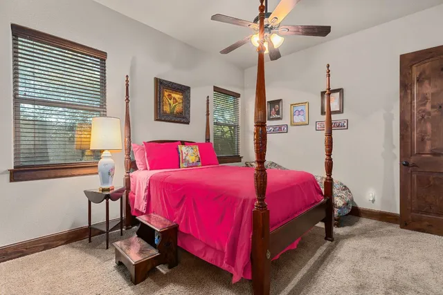 a kitchen with stainless steel appliances granite countertop a sink a stove and a wooden floors