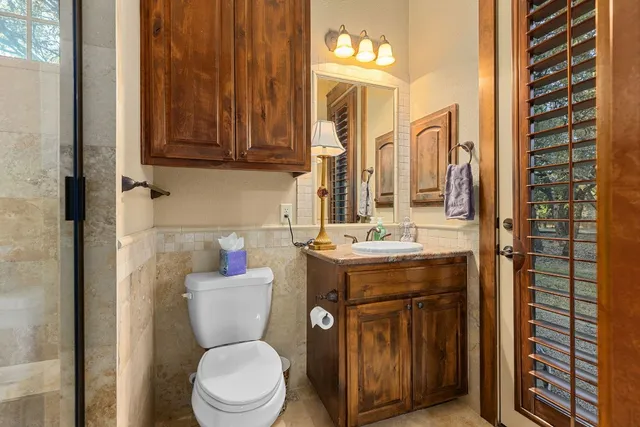 a bed room with a bed and a lamp