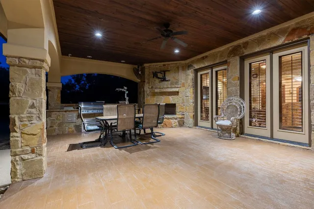 a view of a kitchen with sink and cabinets
