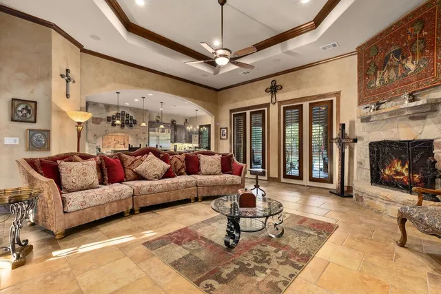 a living room with furniture and a fireplace
