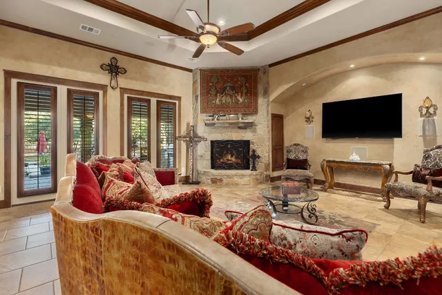 a living room with fireplace furniture and a flat screen tv