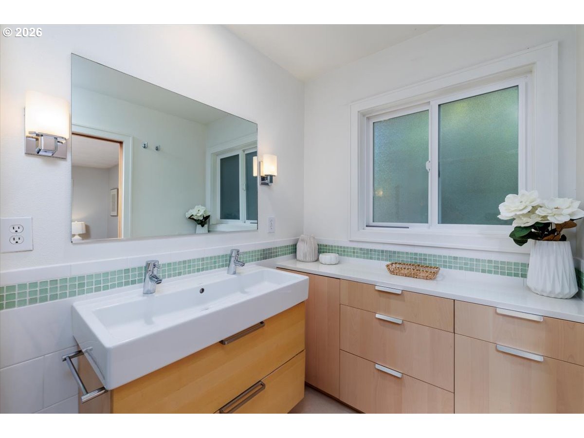 175 Northwest 95th Avenue Portland, OR 97229 - Photo 18 of 46 a bathroom with a sink and a mirror