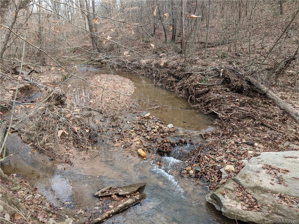 0 Hill Farm Road Hiddenite, NC 28636 - Photo 1 of 19 a view of a dry yard with large trees