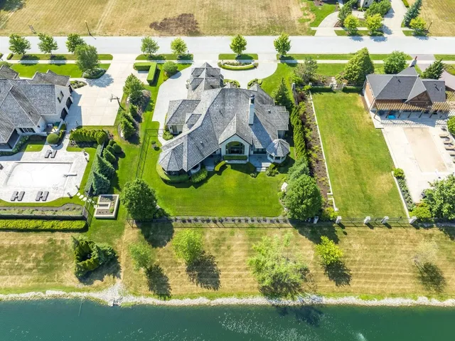 an aerial view of a house with a swimming pool