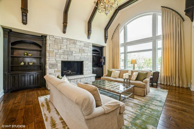 a living room with furniture fireplace and flat screen tv