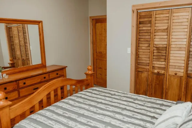 a bed room with a bed and a couch