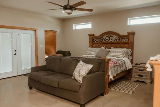 a view of walk in closet with clothes