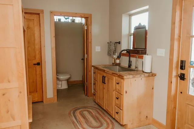 a kitchen with stainless steel appliances granite countertop a sink and a cabinets