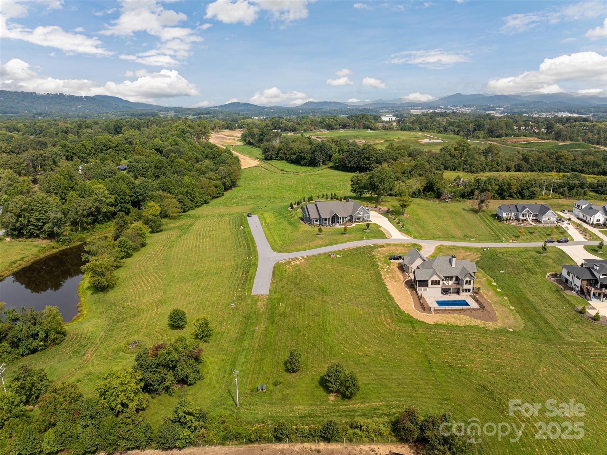 301 Majestic Ridge Road, Unit 57 Mills River, NC 28759 - Photo 12 of 25 a view of a swimming pool with a yard