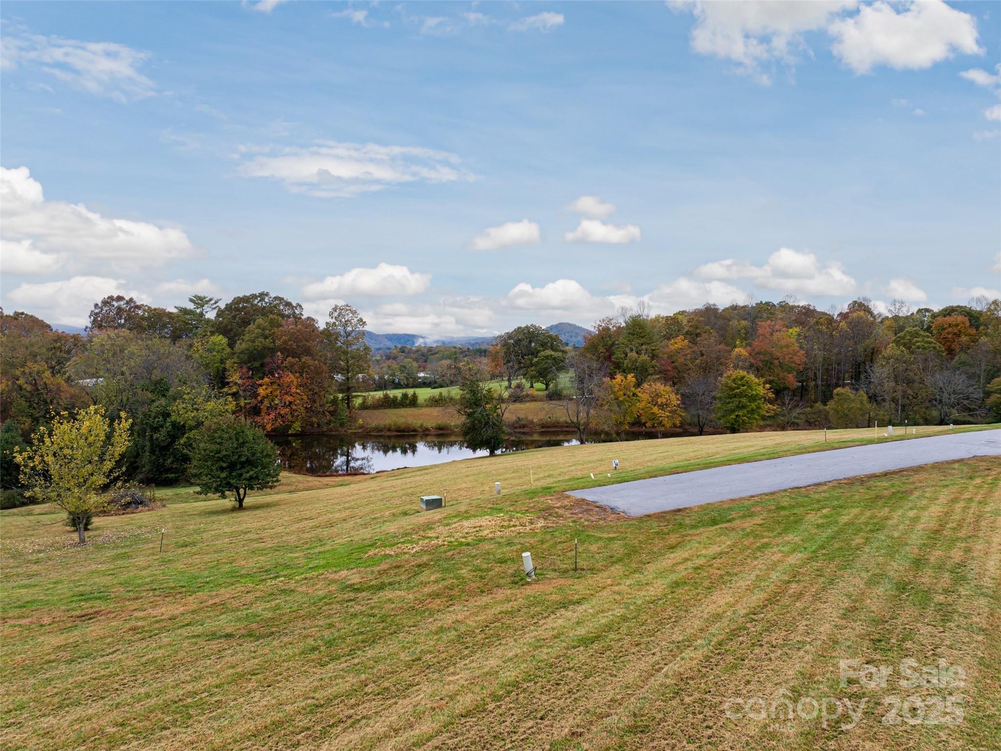 301 Majestic Ridge Road, Unit 57 Mills River, NC 28759 - Photo 18 of 25 a view of a swimming pool with an ocean in the background