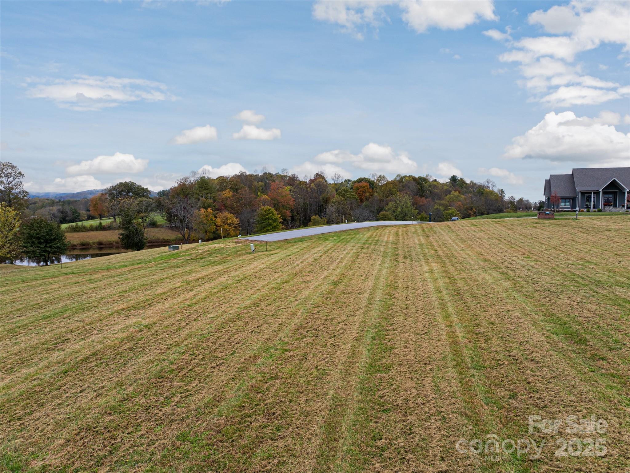 301 Majestic Ridge Road, Unit 57 Mills River, NC 28759 - Photo 23 of 25 a view of an outdoor space and lake view