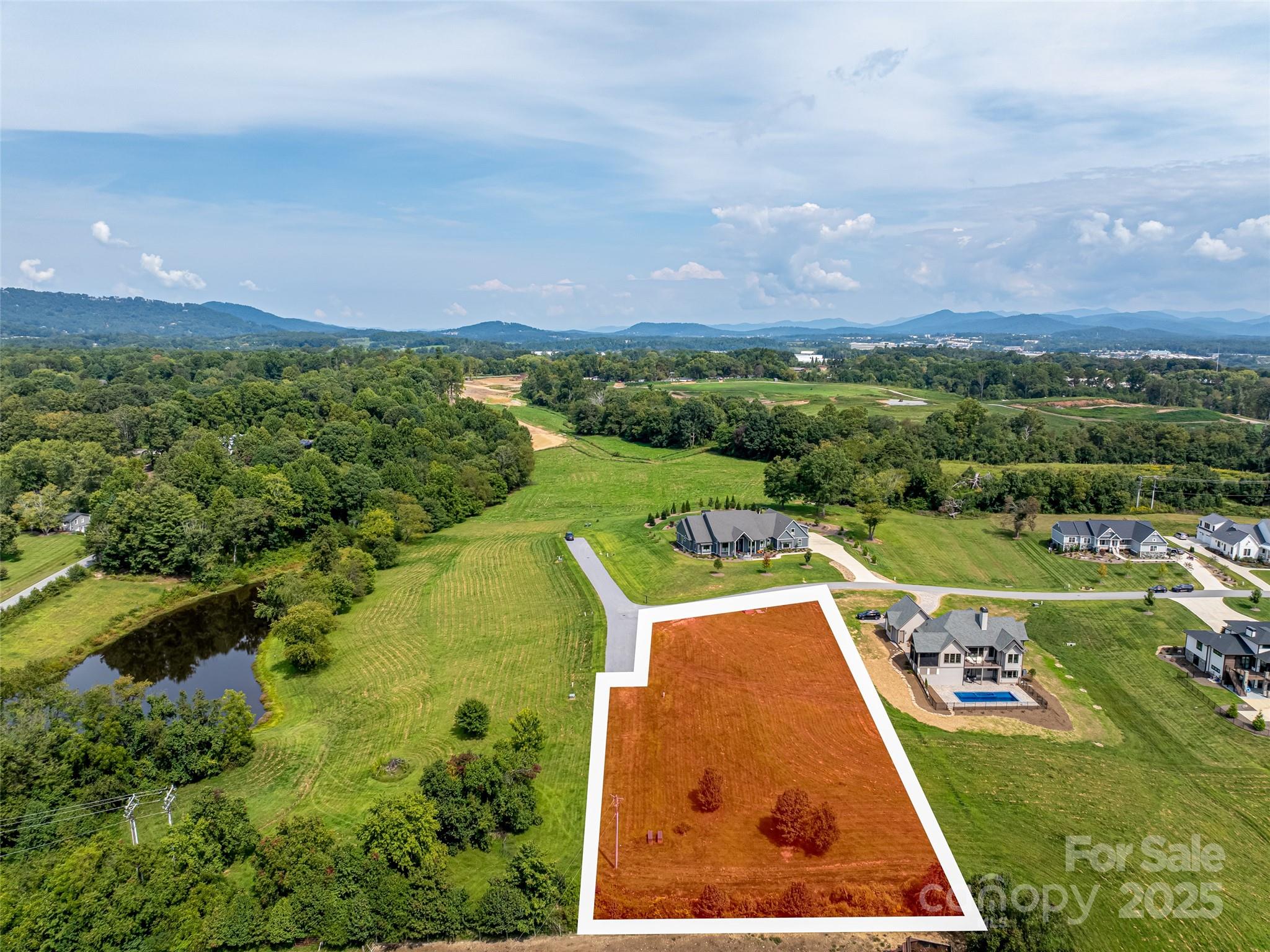301 Majestic Ridge Road, Unit 57 Mills River, NC 28759 - Photo 3 of 25 an aerial view of a house with a garden