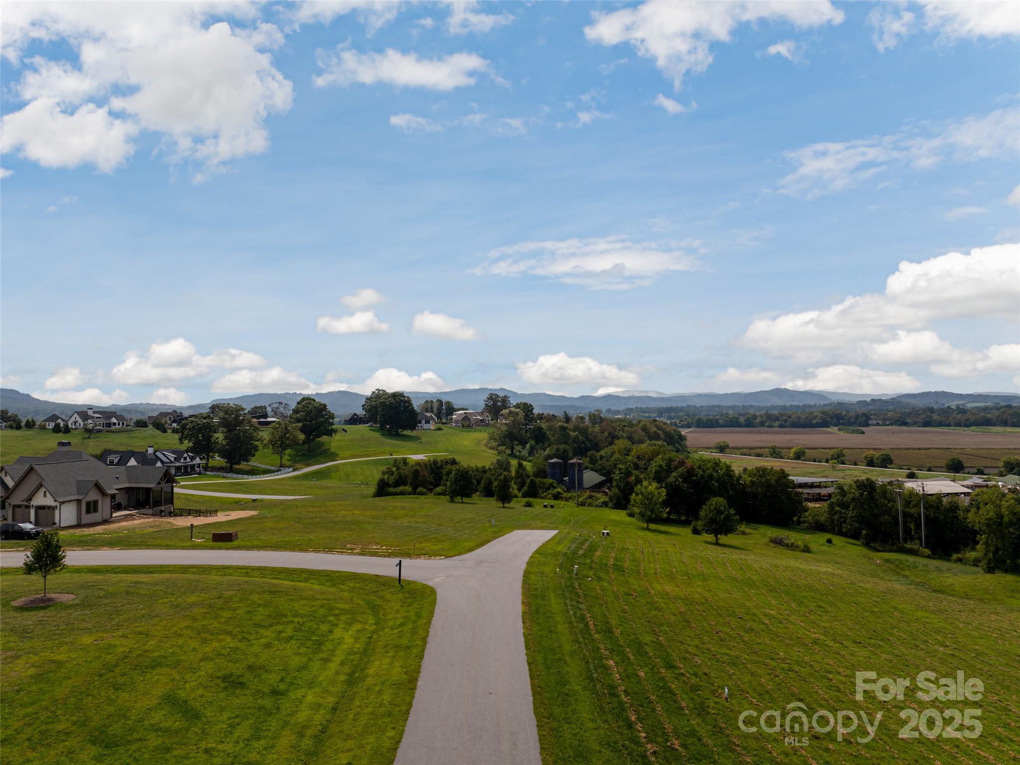 301 Majestic Ridge Road, Unit 57 Mills River, NC 28759 - Photo 4 of 25 a view of a golf course with a lake