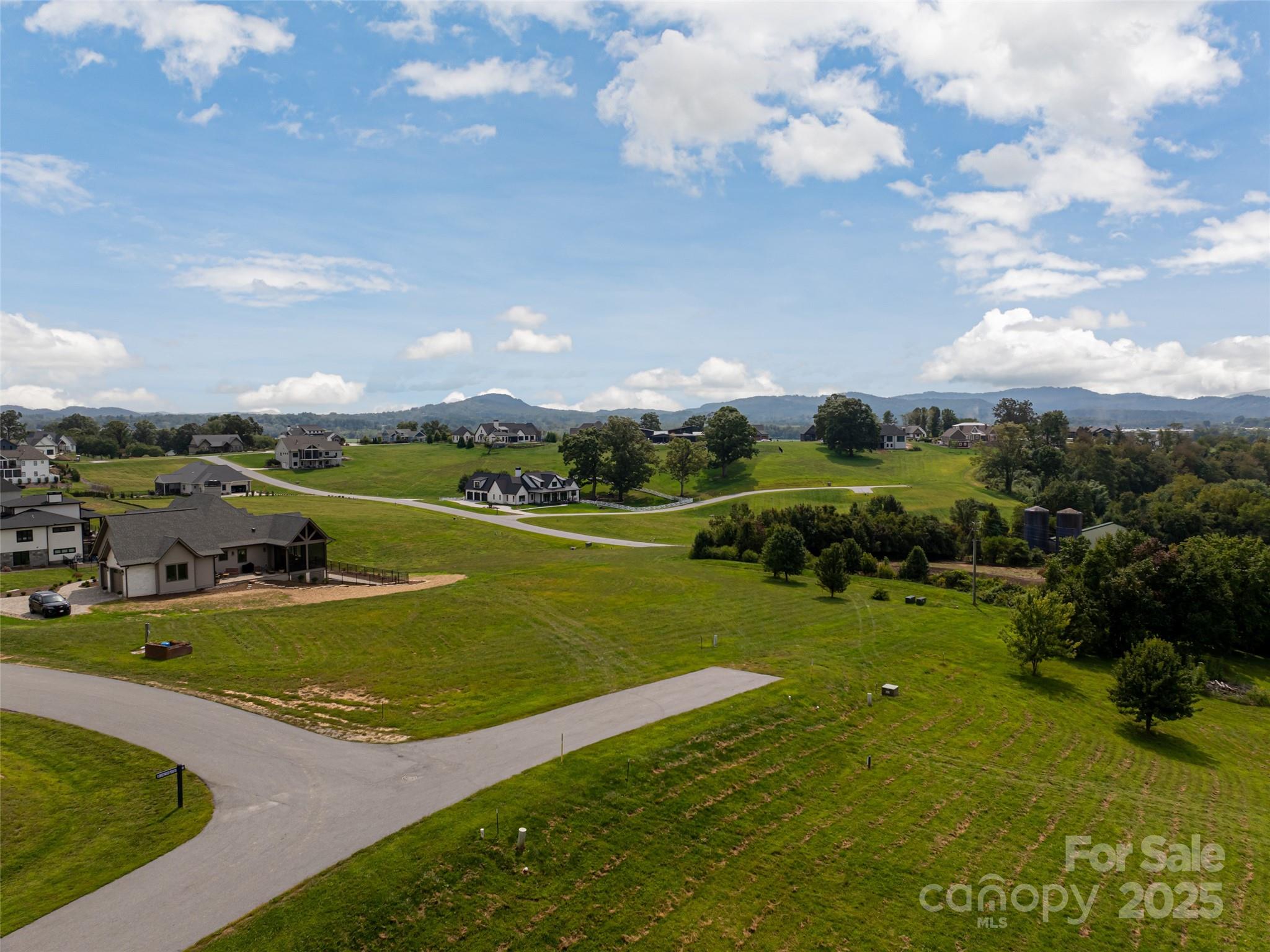 301 Majestic Ridge Road, Unit 57 Mills River, NC 28759 - Photo 5 of 25 a view of a big yard with swimming pool and green space