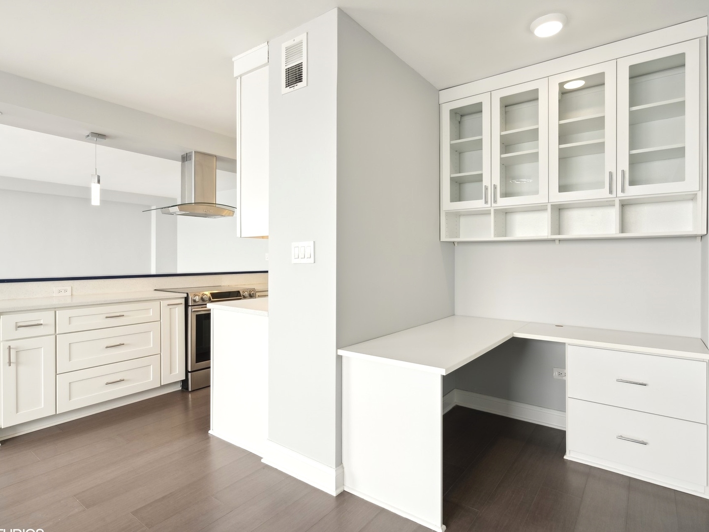 3180 North Lake Shore Drive, Unit 17E Chicago, IL 60657 - Photo 12 of 38 a hallway with cabinets