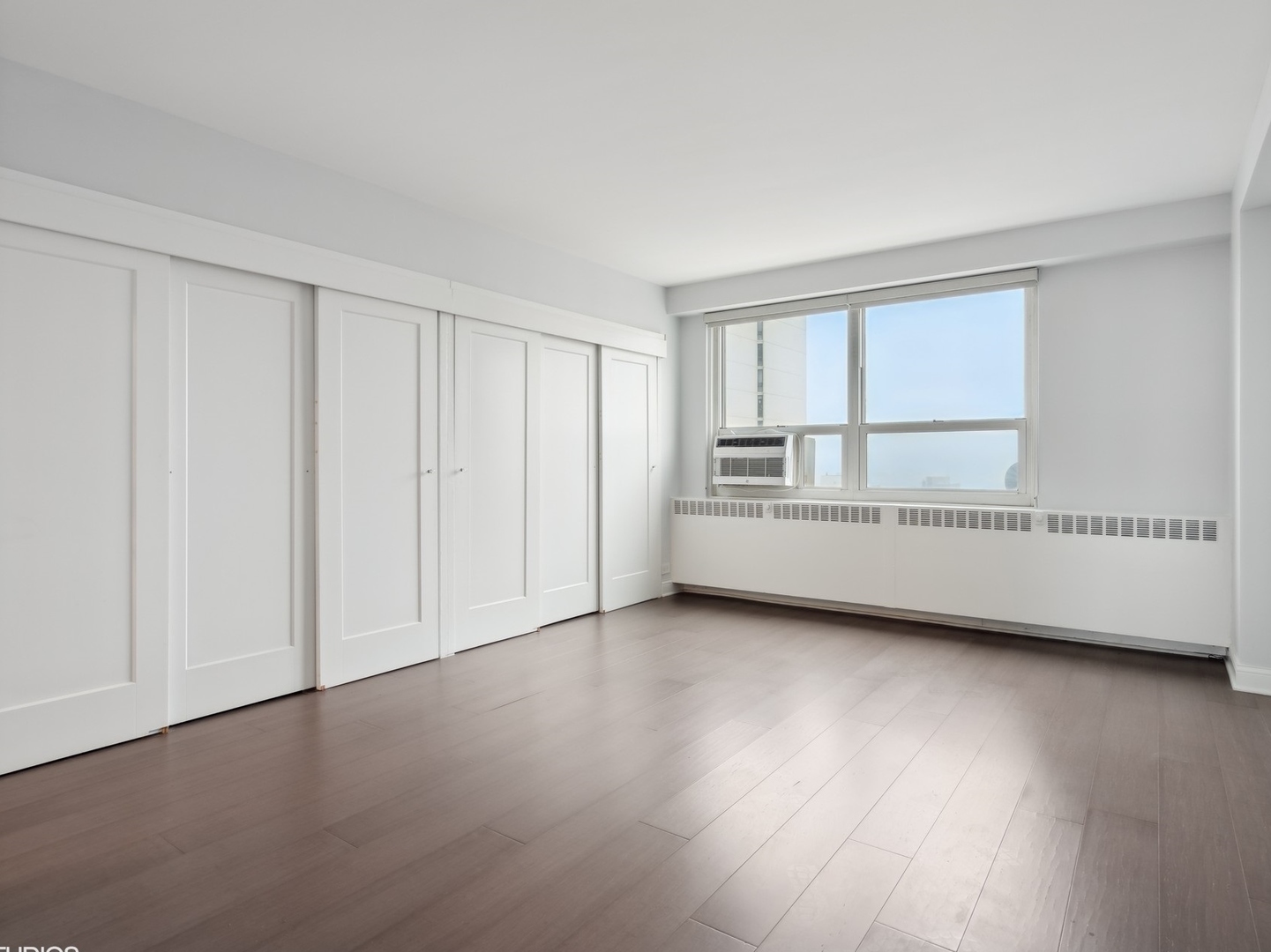3180 North Lake Shore Drive, Unit 17E Chicago, IL 60657 - Photo 24 of 38 a view of an empty room with a window