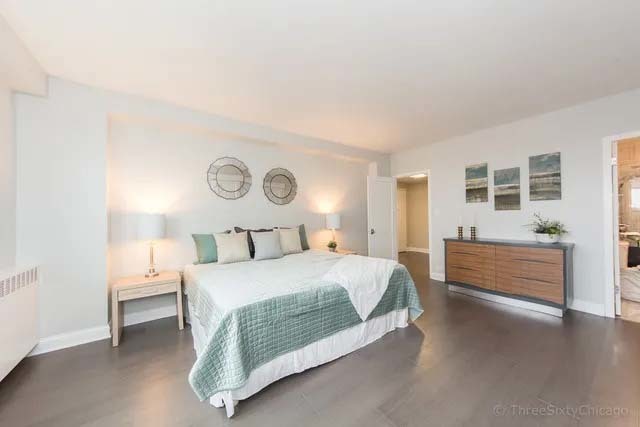 3180 North Lake Shore Drive, Unit 17E Chicago, IL 60657 - Photo 28 of 38 a bedroom with a bed and a window