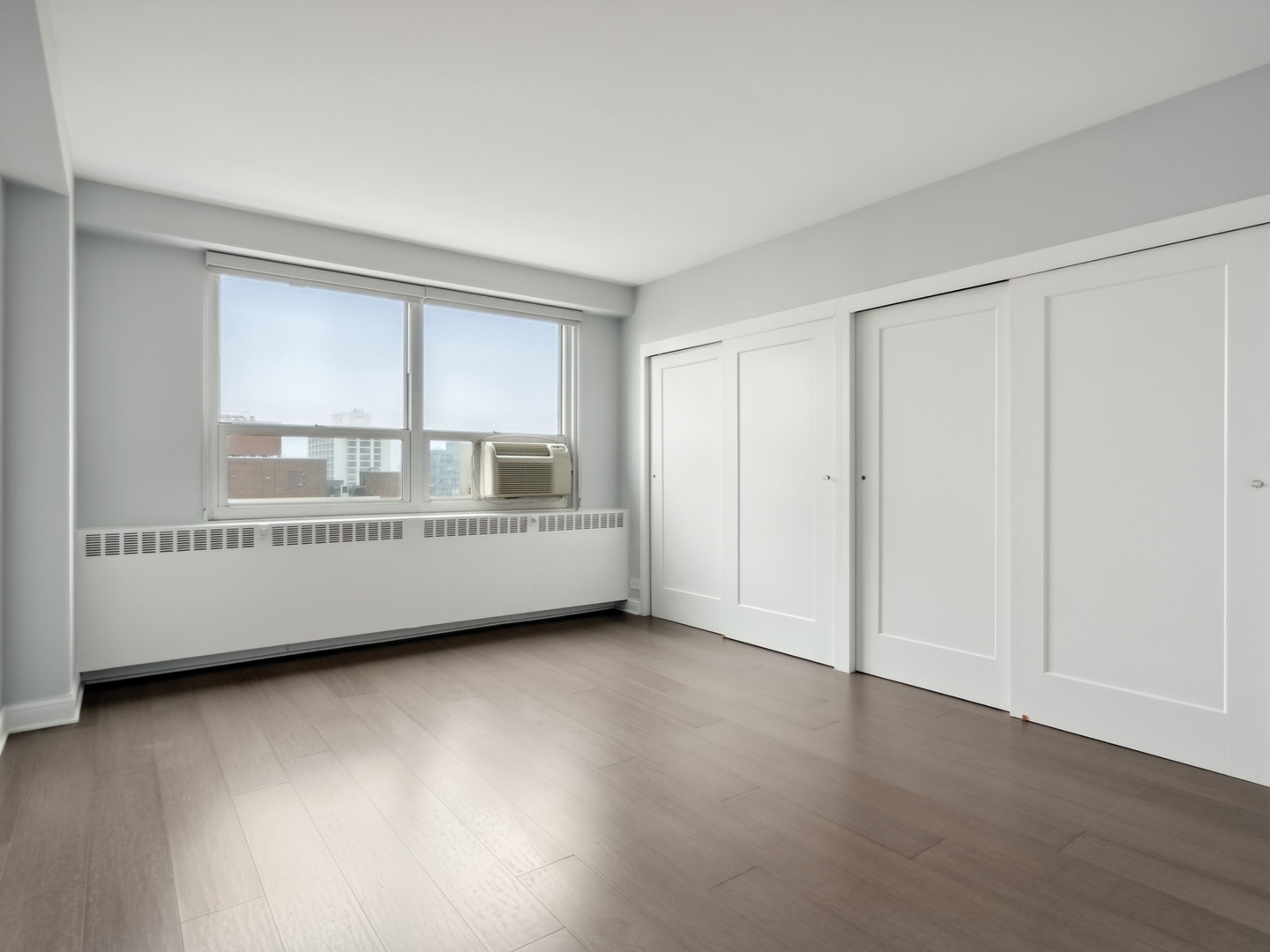 3180 North Lake Shore Drive, Unit 17E Chicago, IL 60657 - Photo 30 of 38 a view of an empty room with a window