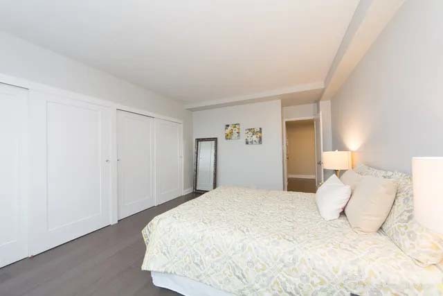 3180 North Lake Shore Drive, Unit 17E Chicago, IL 60657 - Photo 34 of 38 a large white bed in a white room