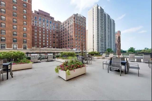 3180 North Lake Shore Drive, Unit 17E Chicago, IL 60657 - Photo 36 of 38 a view of a patio with couches and a table and chairs