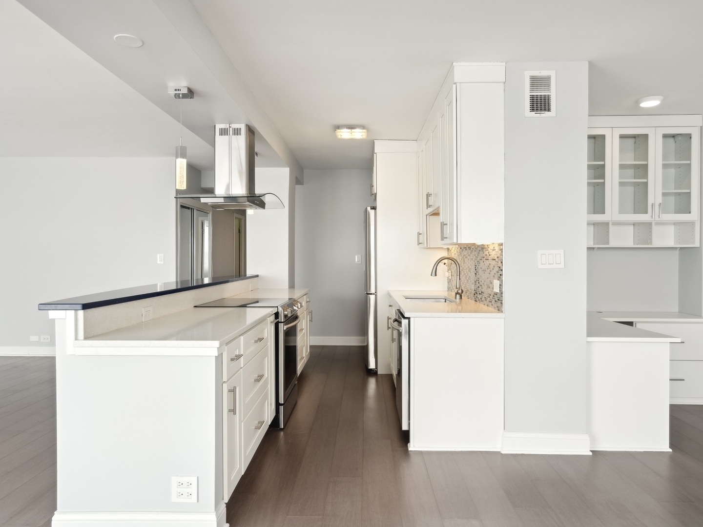 3180 North Lake Shore Drive, Unit 17E Chicago, IL 60657 - Photo 6 of 38 a kitchen with a sink and a refrigerator