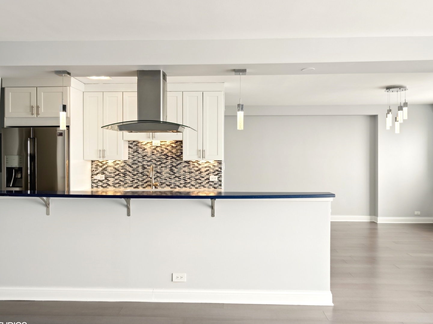 3180 North Lake Shore Drive, Unit 17E Chicago, IL 60657 - Photo 7 of 38 a view of a living room with a wooden floor